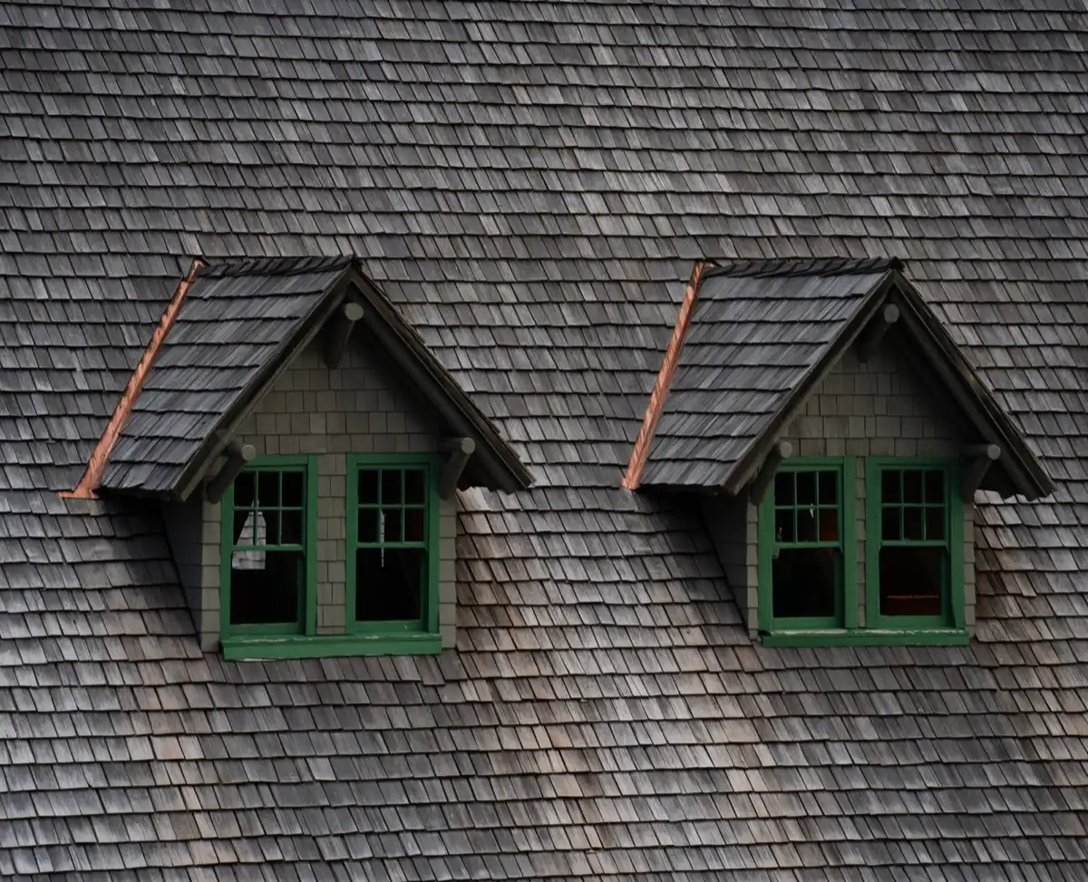 Dormers on a shingle roof in Concord, CA, where step flashing and kickout flashing carry water past the walls